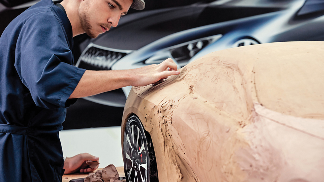 A Lexus designer sculpting a clay model